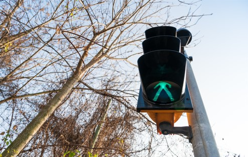 pedestrian crosswalk signal with walk sign